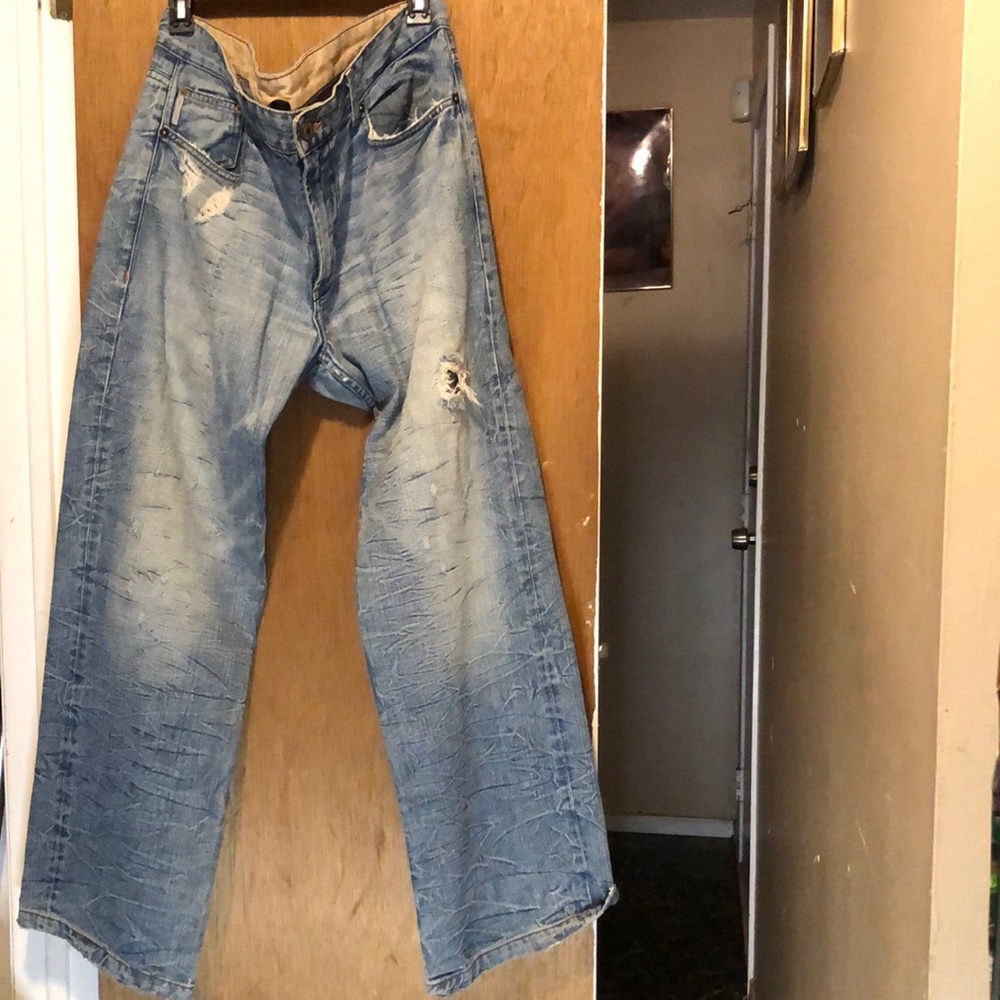 Jeans light wash sz 38 reg worn a few a times rip at bottom leg